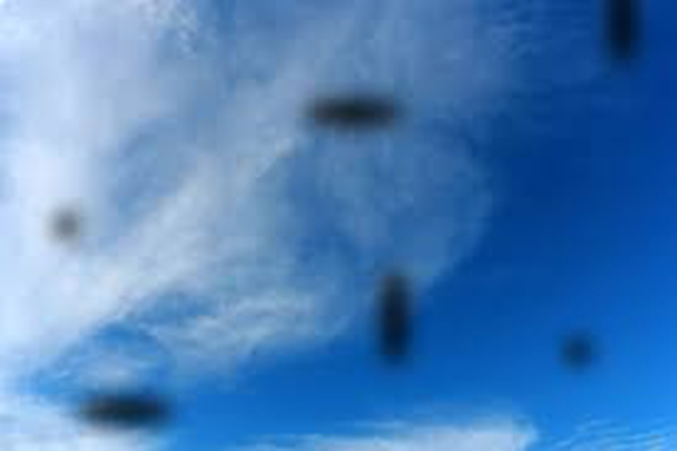 Image of floaters over a blue sky